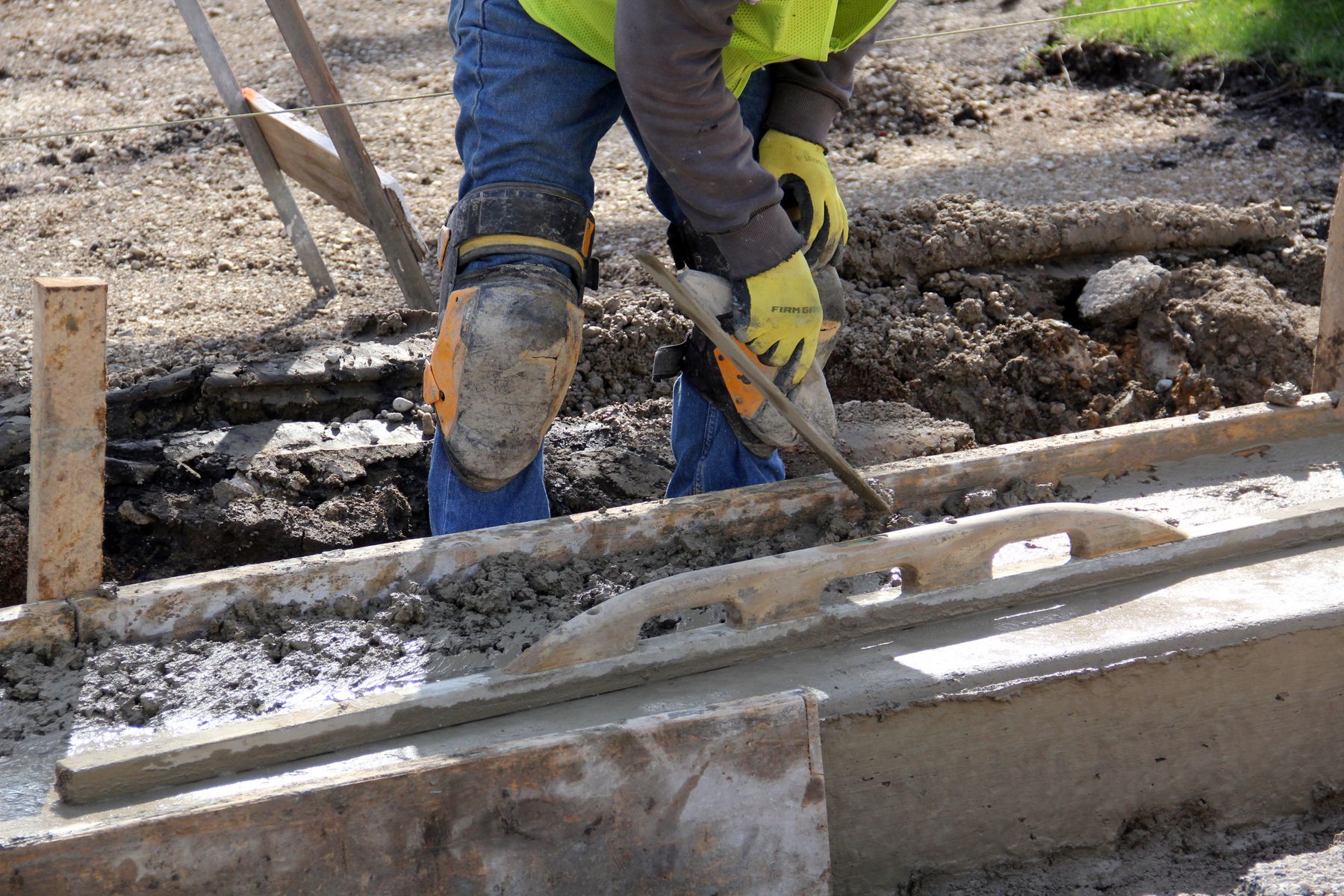 Hand trowel smoothing fresh concrete